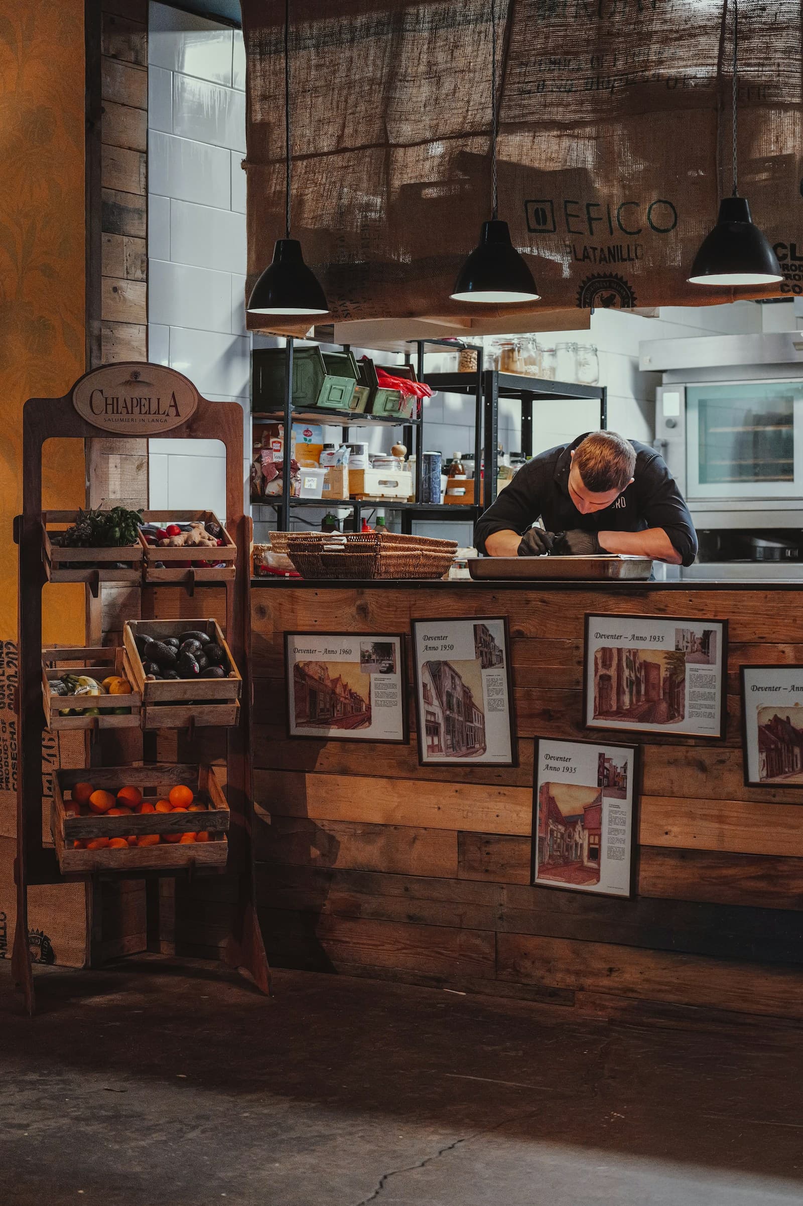 Chef preparing food behind a restaurant counter